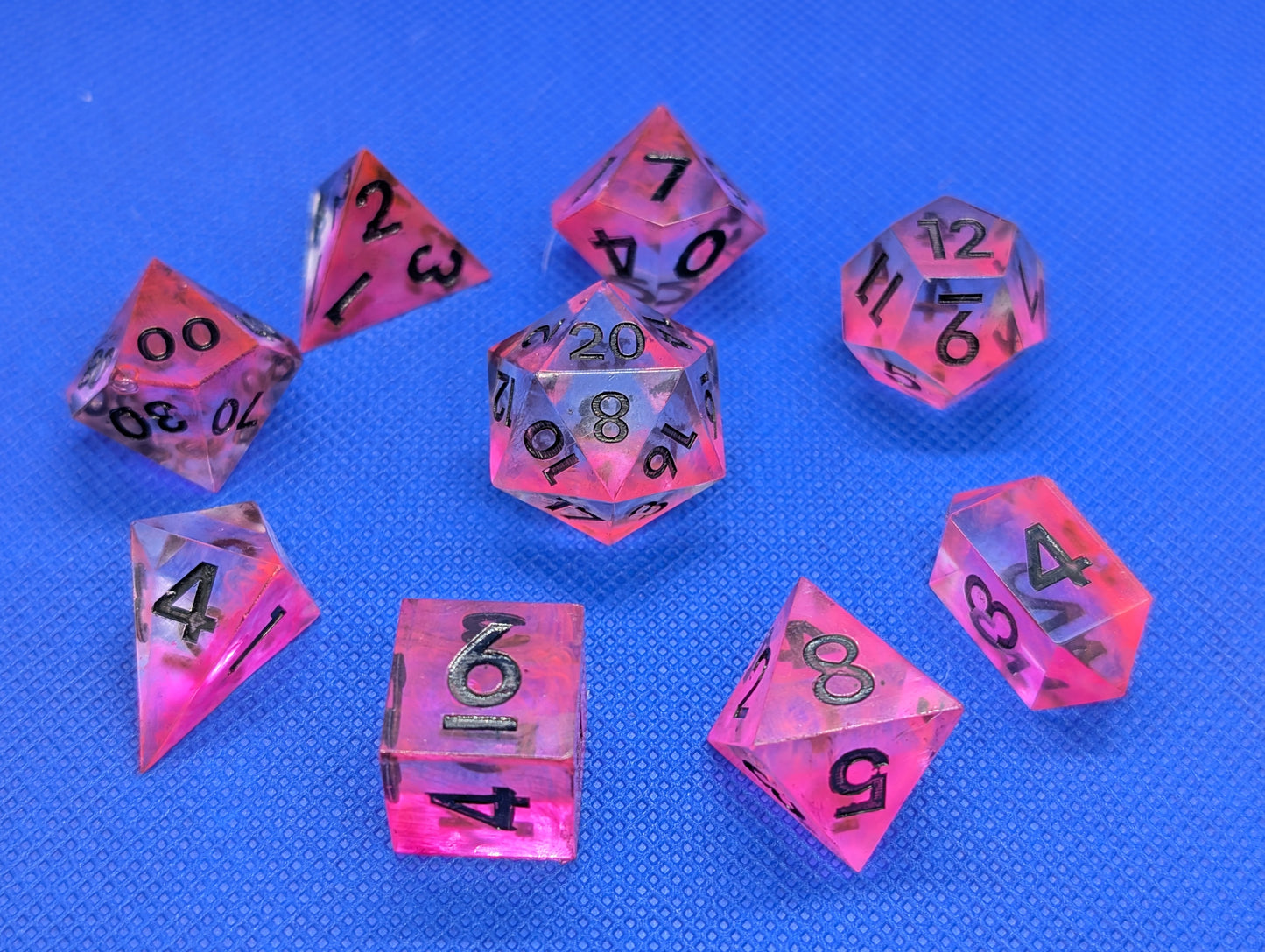 UV Reactive Pink and Clear Polyhedral Dice Set inc. shard d4 and gem d4 with black numbering